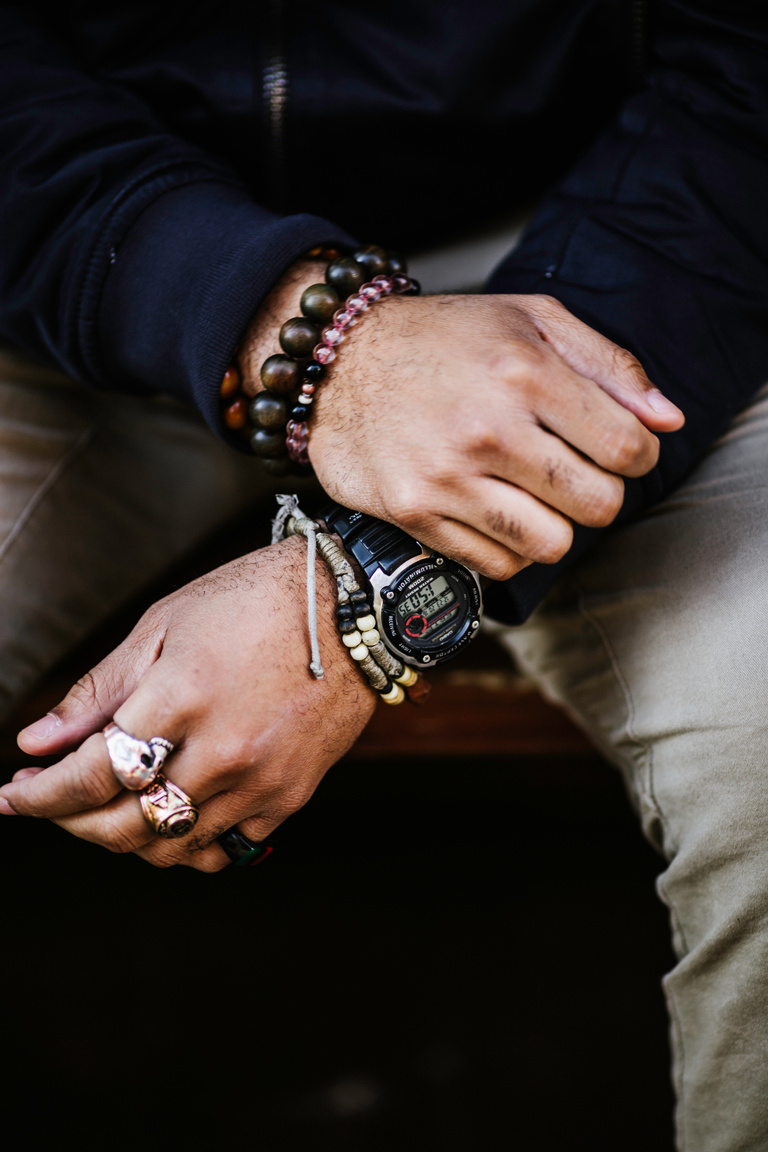 A Man Wearing a Watch, Bracelets and Rings
